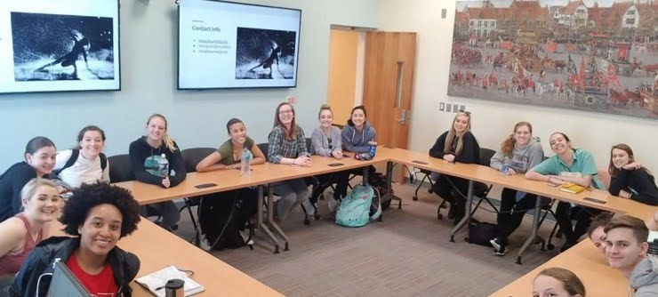 Students gathered in a conference room.