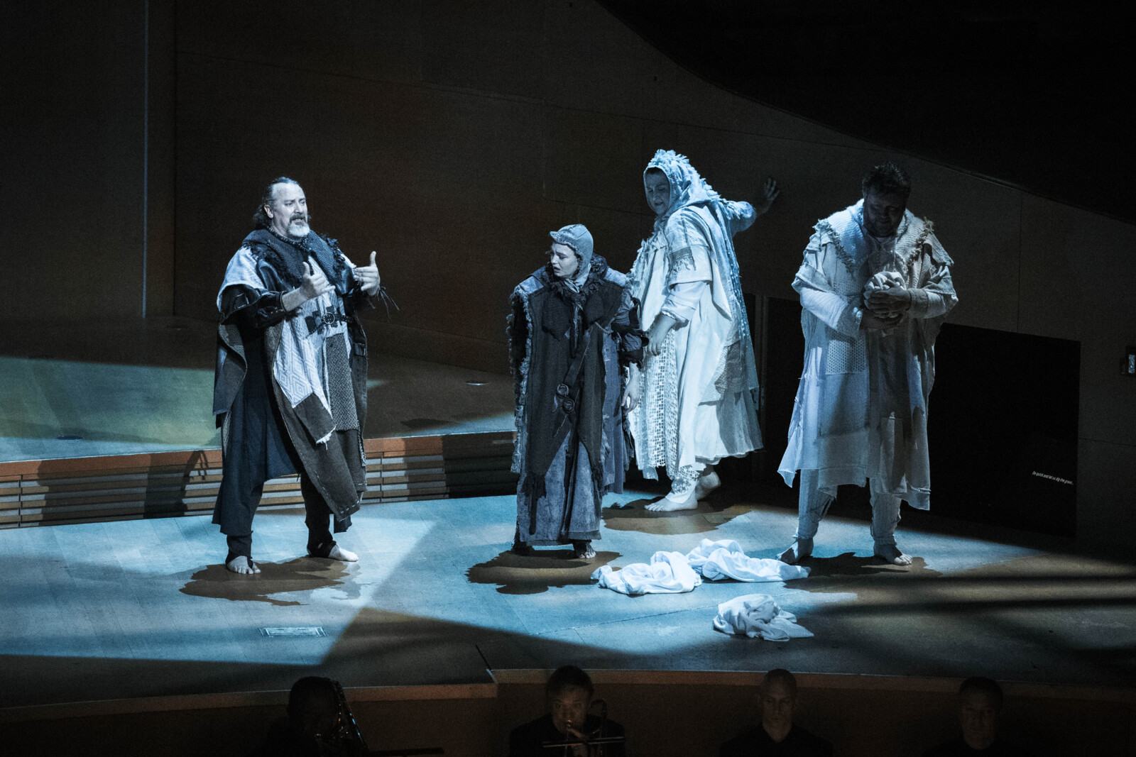 Deaf actors perform in a theater production on stage.